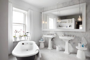 Large bathroom mirror and vanity storage for a modern renovation